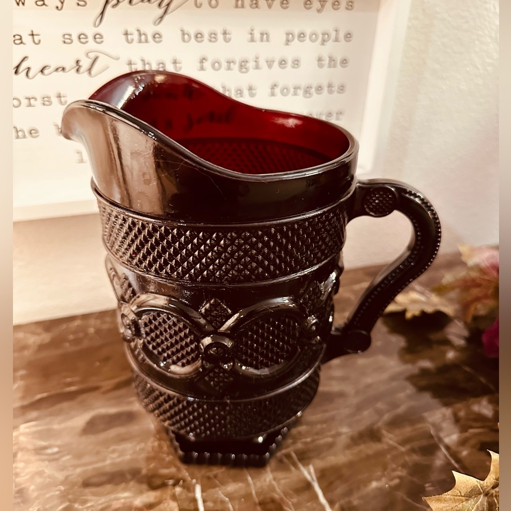 SOLD A beautiful dark red pitcher.